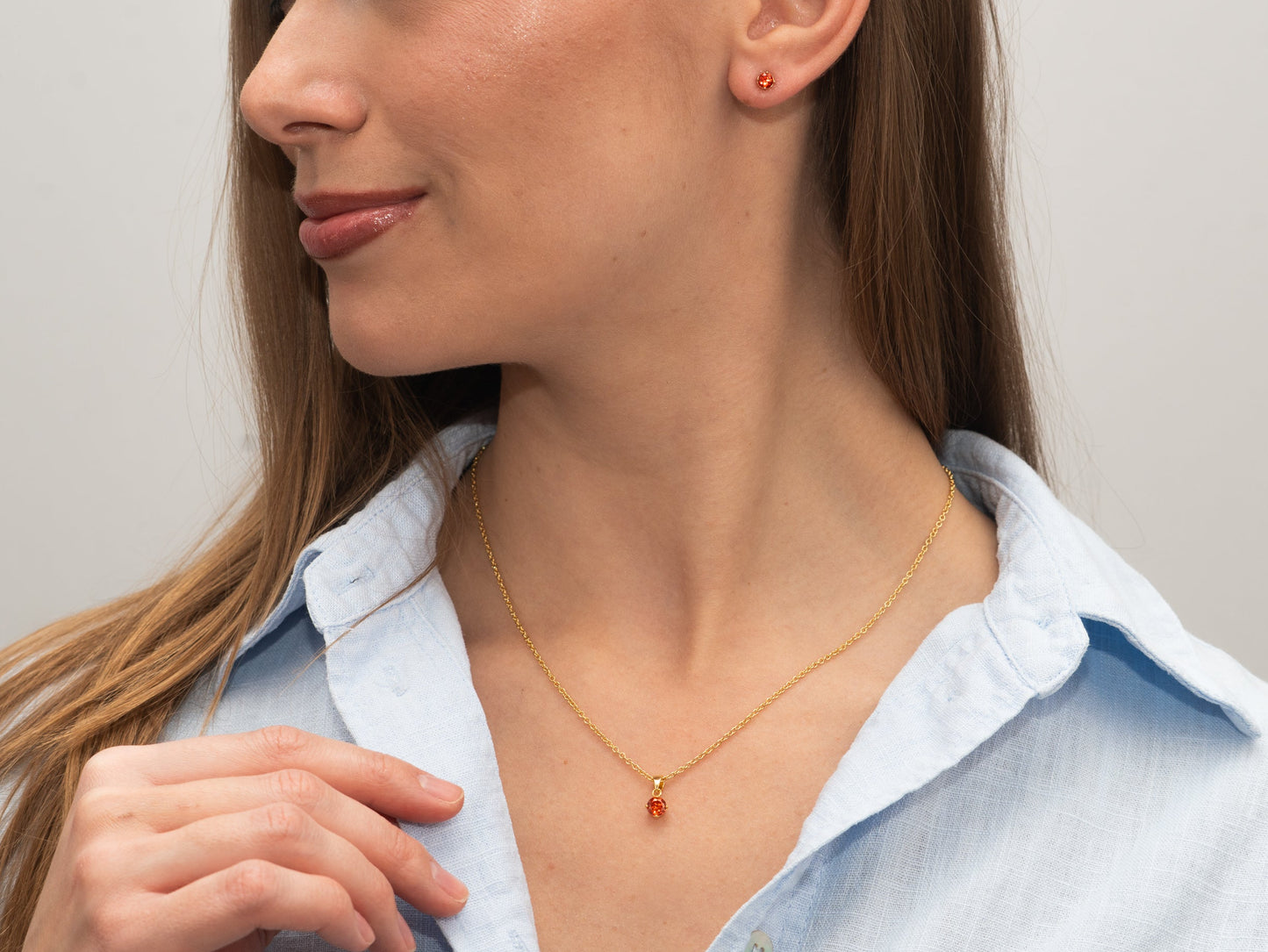 Silber-Ohrringe 4 mm mit orangem Zirkonia, vergoldet miaGemo